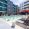 swimming pool in a courtyard with lounge chairs