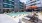 swimming pool in a courtyard with lounge chairs
